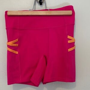 Vibrant Pink Athletic Shorts with Orange Accents